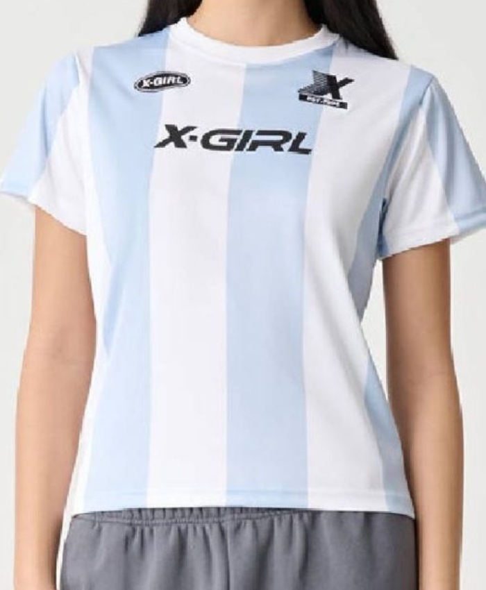 Shop Ayisha Salem-Towner Neighbours 2025 Nell Rebecchi Football Baby T-Shirt