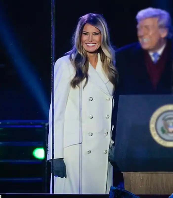 First lady Melania Trump Christmas Tree Lighting Ceremony White Trench Coat