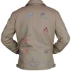 Louis Tomlinson beige jacket with buttoned cuffs and functional pockets
