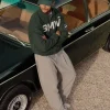 Close-up-of-Kith-for-BMW-2026-Vitality-Green-Zip-Up-Suede-Coaches-Jacket