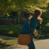 Movie The End of Oak Street 2026 Anne Hathaway Blue Denim Jacket Back View