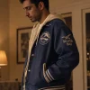 Shah Latif TV Series Bait 2026 Riz Ahmed Blue Leather Varsity Jacket Side View