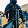 Olaolu Slawn World’s Largest Crane Painting London Black Puffer Jacket