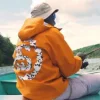 Stüssy x Denim Tears Fall Winter 2026 Collection Orange Hooded Jacket Back